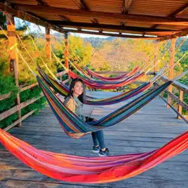 girl in hammock while glamping