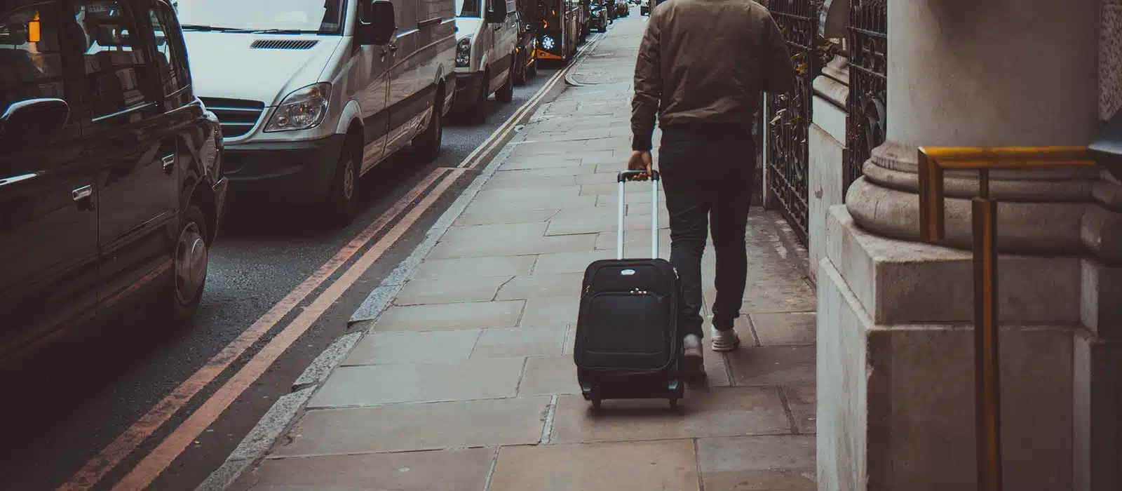 Guying pulling his luggage