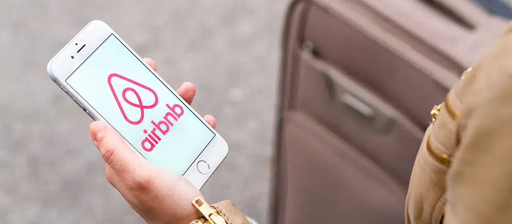 airbnb app in a woman's hand