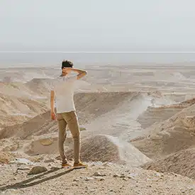 Guy looking out at desert in Israel