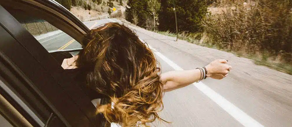 overnight road trip - lady in passenger seat of car