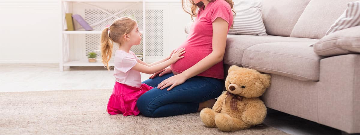 pregnant mom with daughter