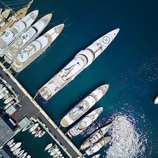 How can I save money when visiting Monaco?