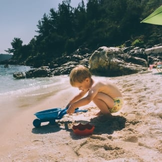What happens if my toddler eats sand at the beach?